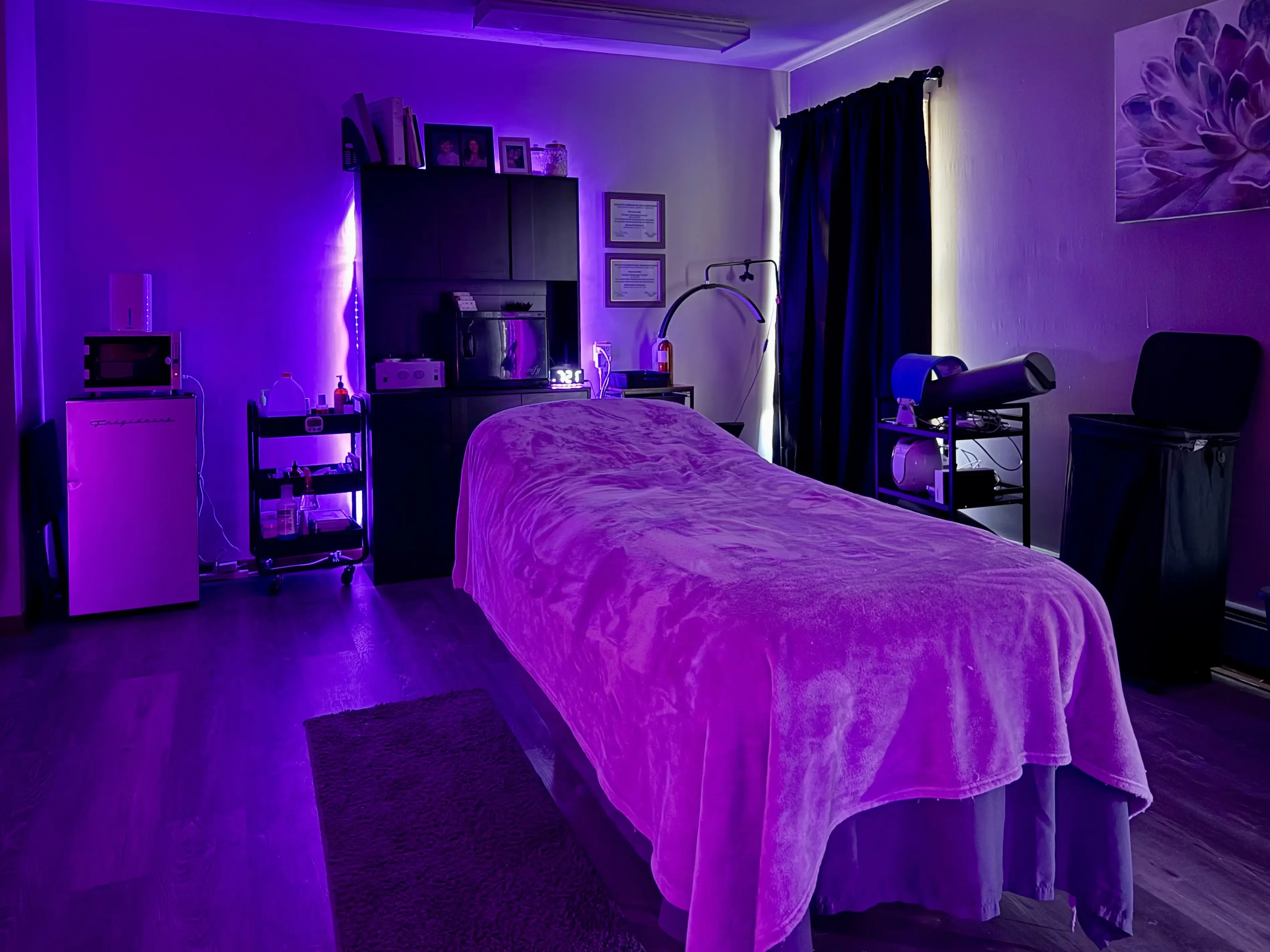 Purple treatment room with ambient lighting at Royal Glow Beauty and Esthetics Boardman Ohio